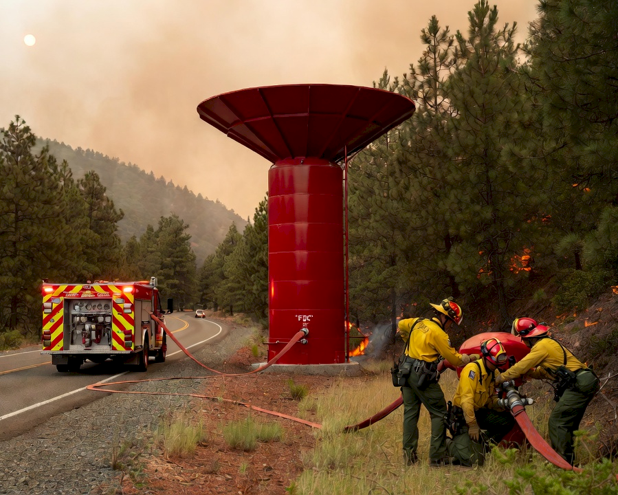 FIREWALL unit deployed on forest road with firefighters